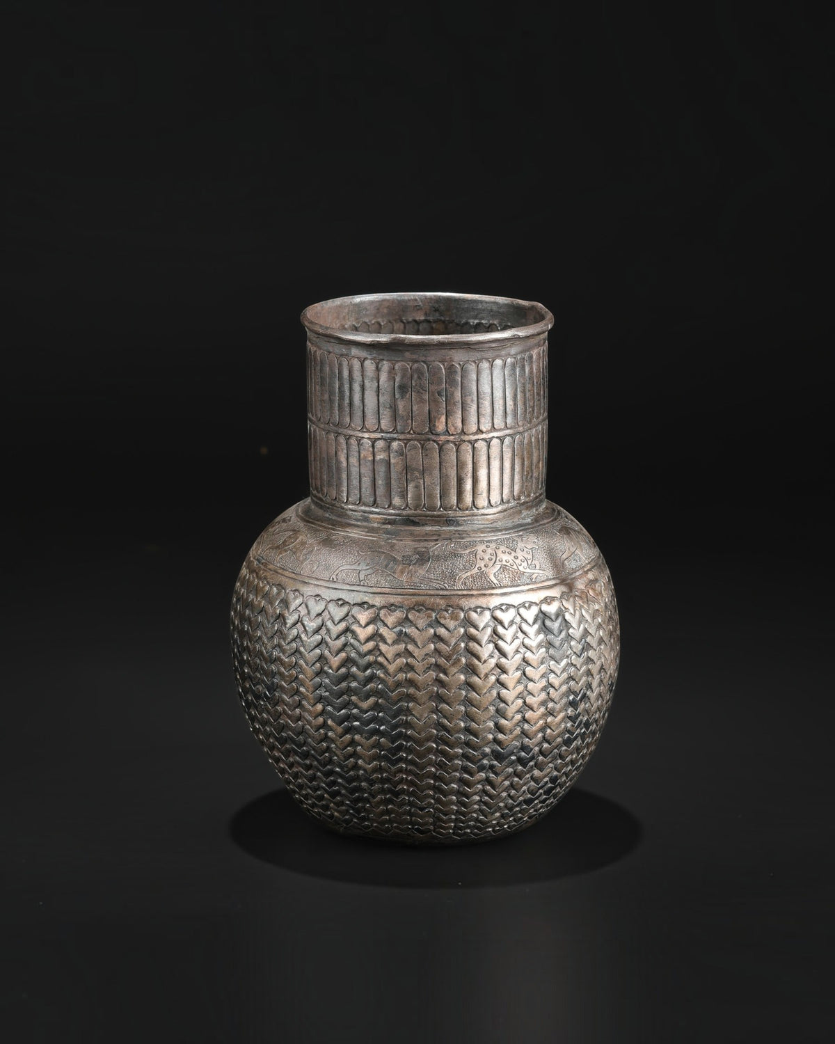 Antique Silver Jug Featuring Intricate Repoussé Decoration and a Heart Patterned Design