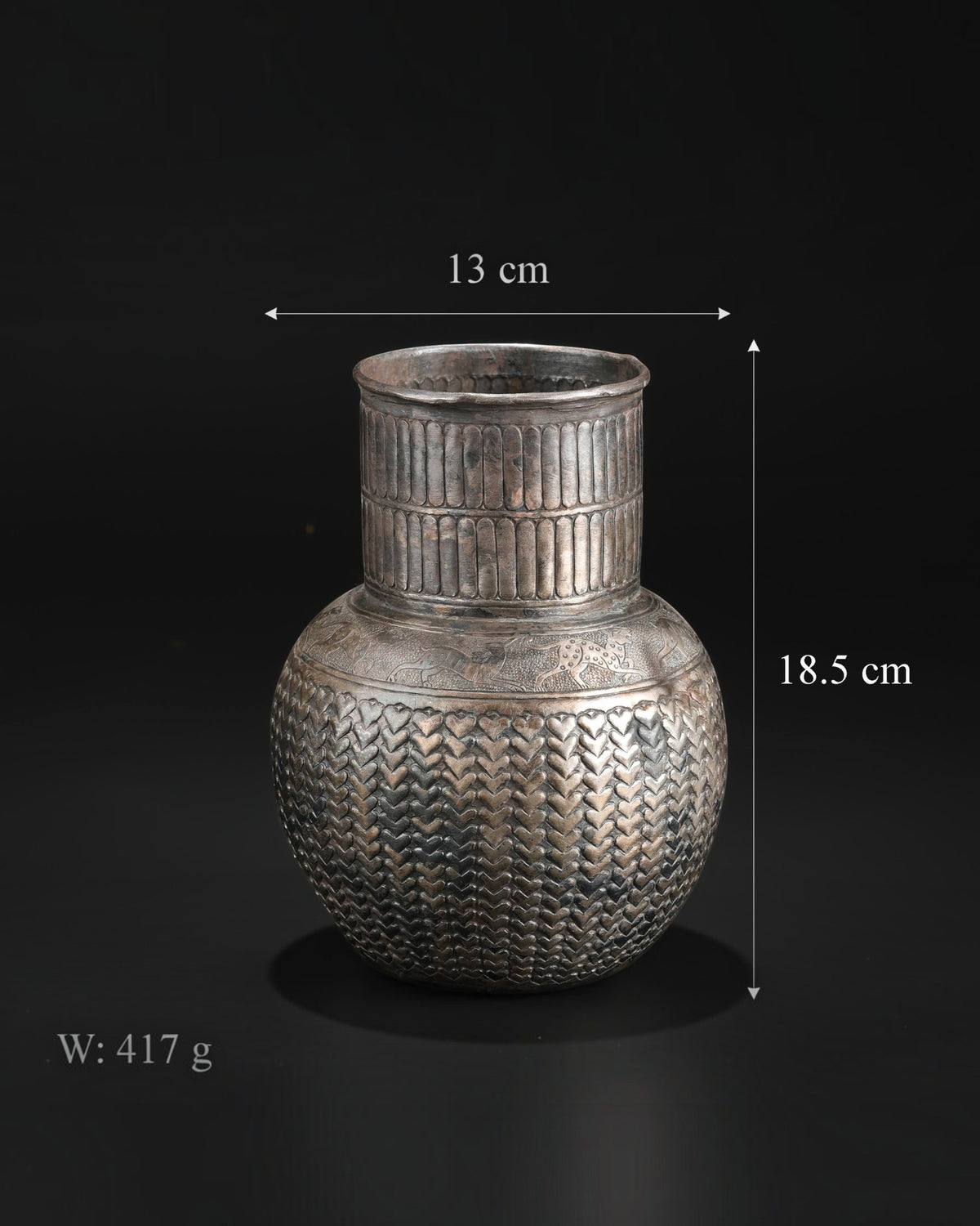 Antique Silver Jug Featuring Intricate Repoussé Decoration and a Heart Patterned Design