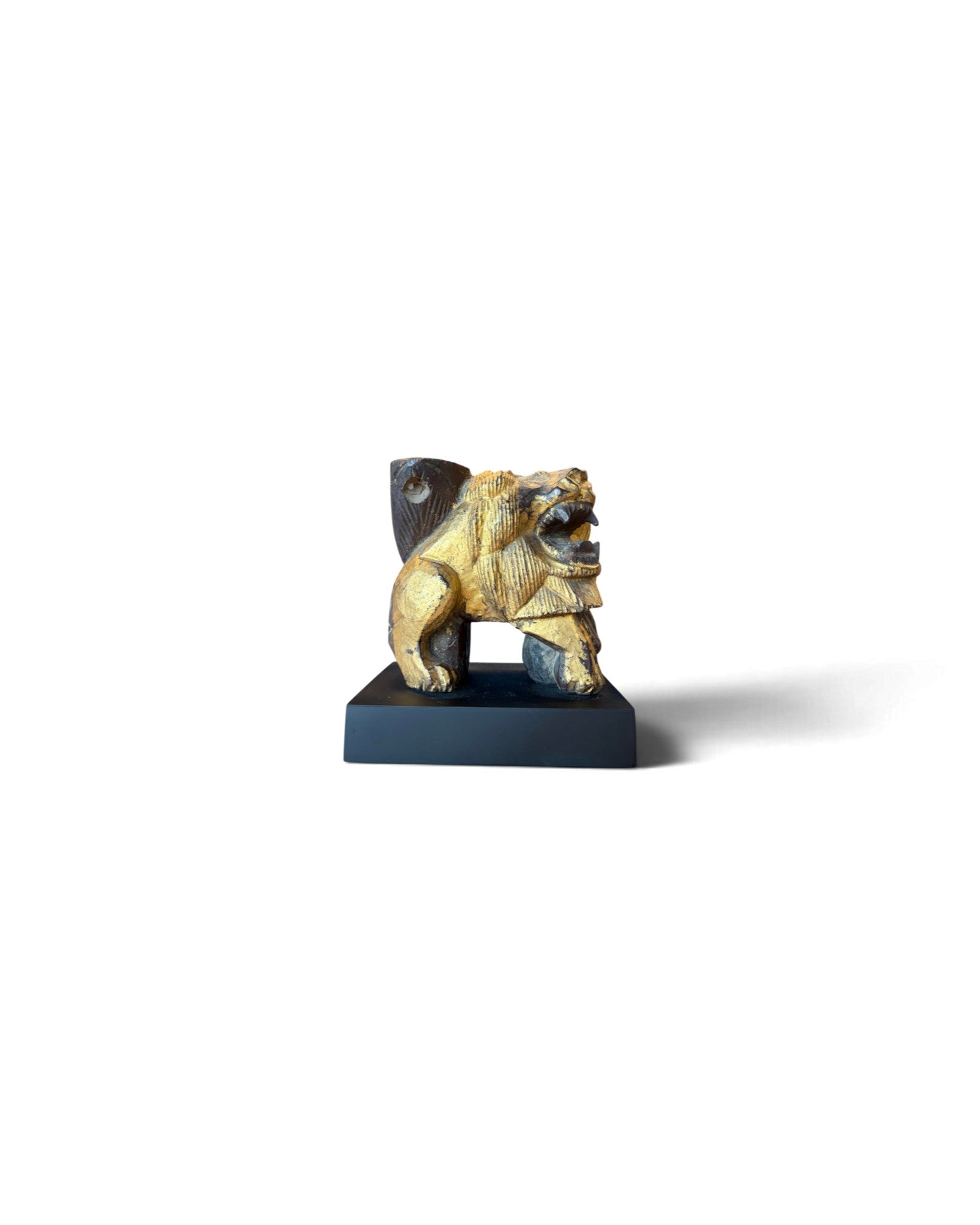Carved Wooden Lion embellished with Gold Leaf (สิงโตไม้ติดทอง)