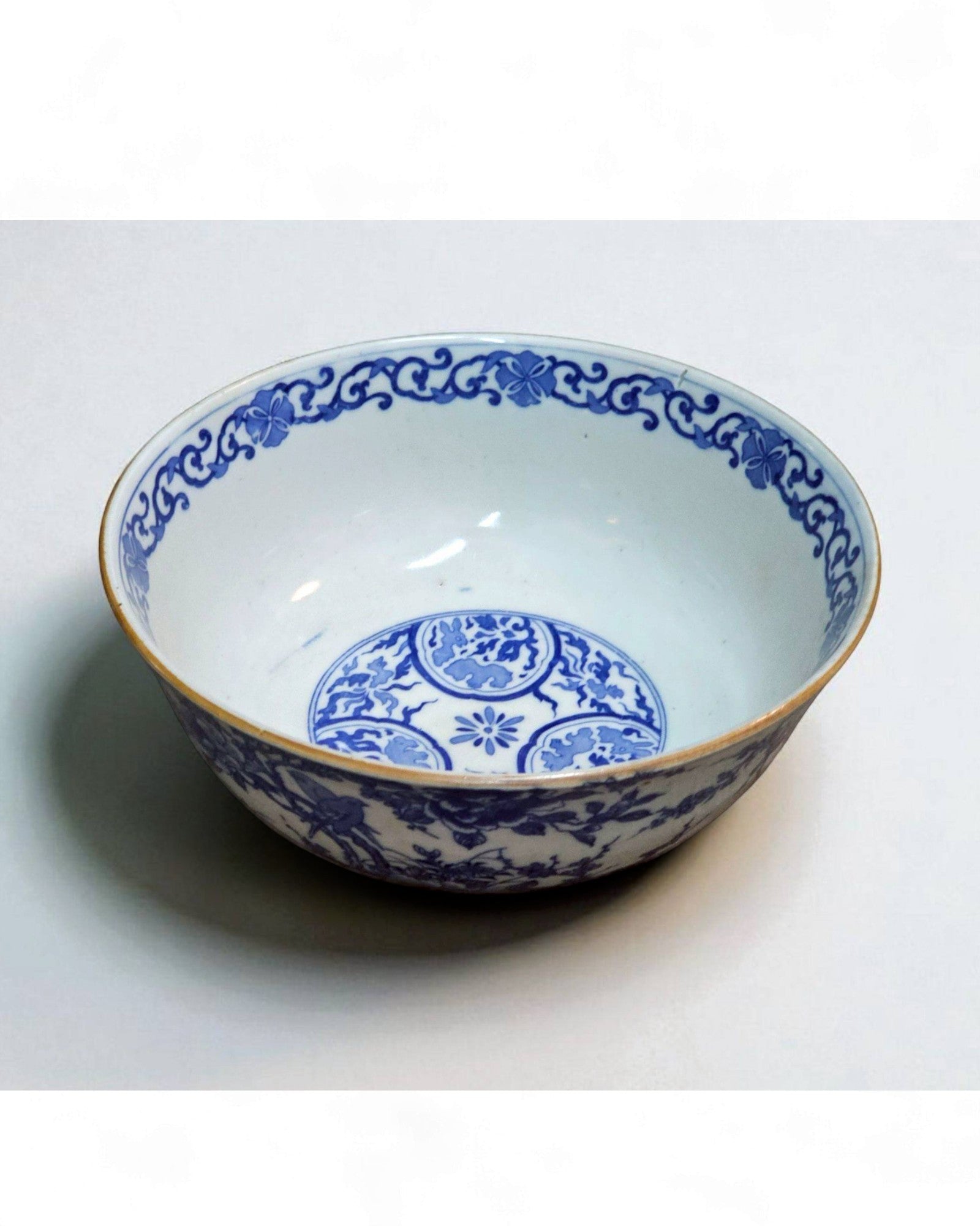 Blue and White Ceramic Bowl with Floral & Bird Motifs