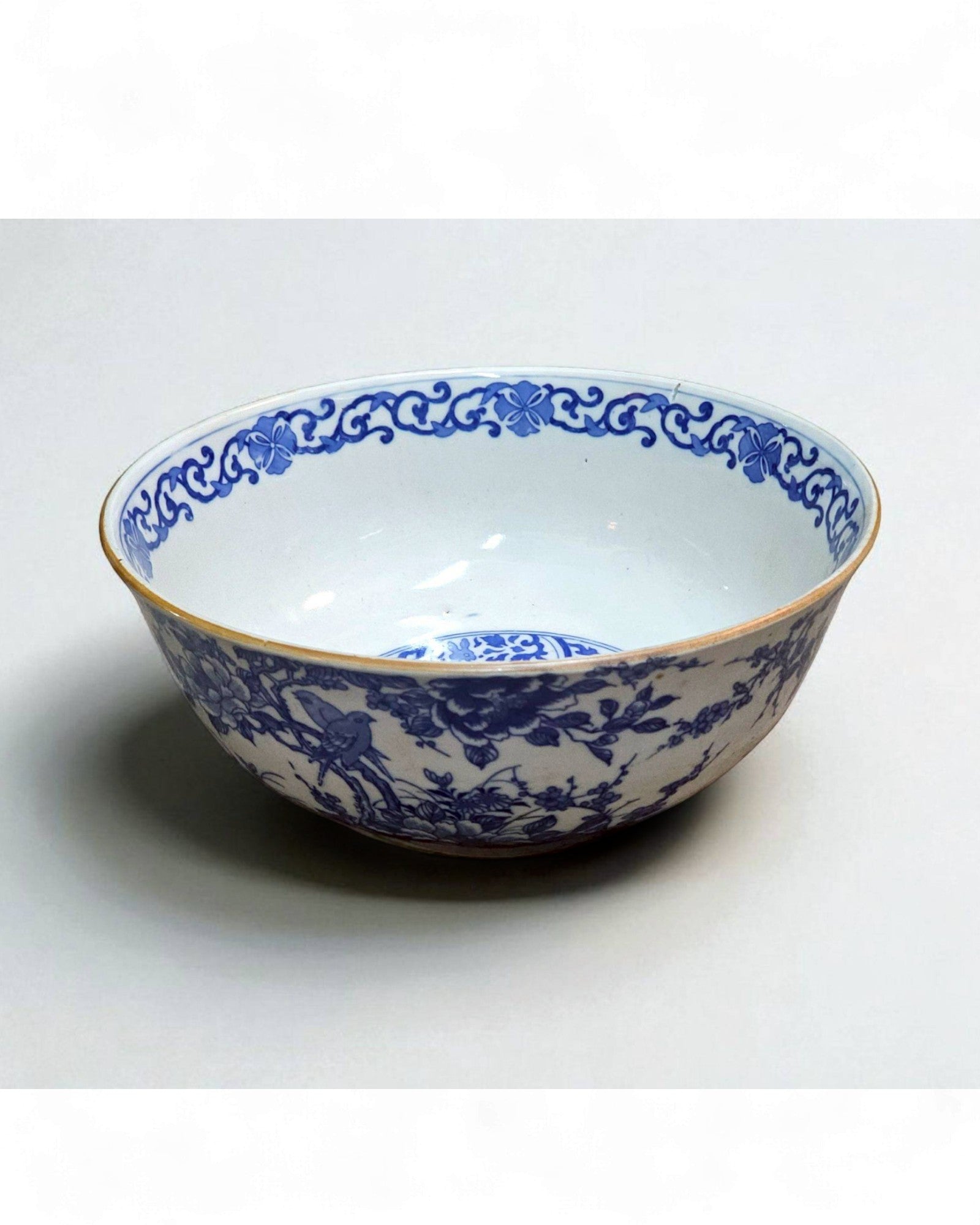 Blue and White Ceramic Bowl with Floral & Bird Motifs