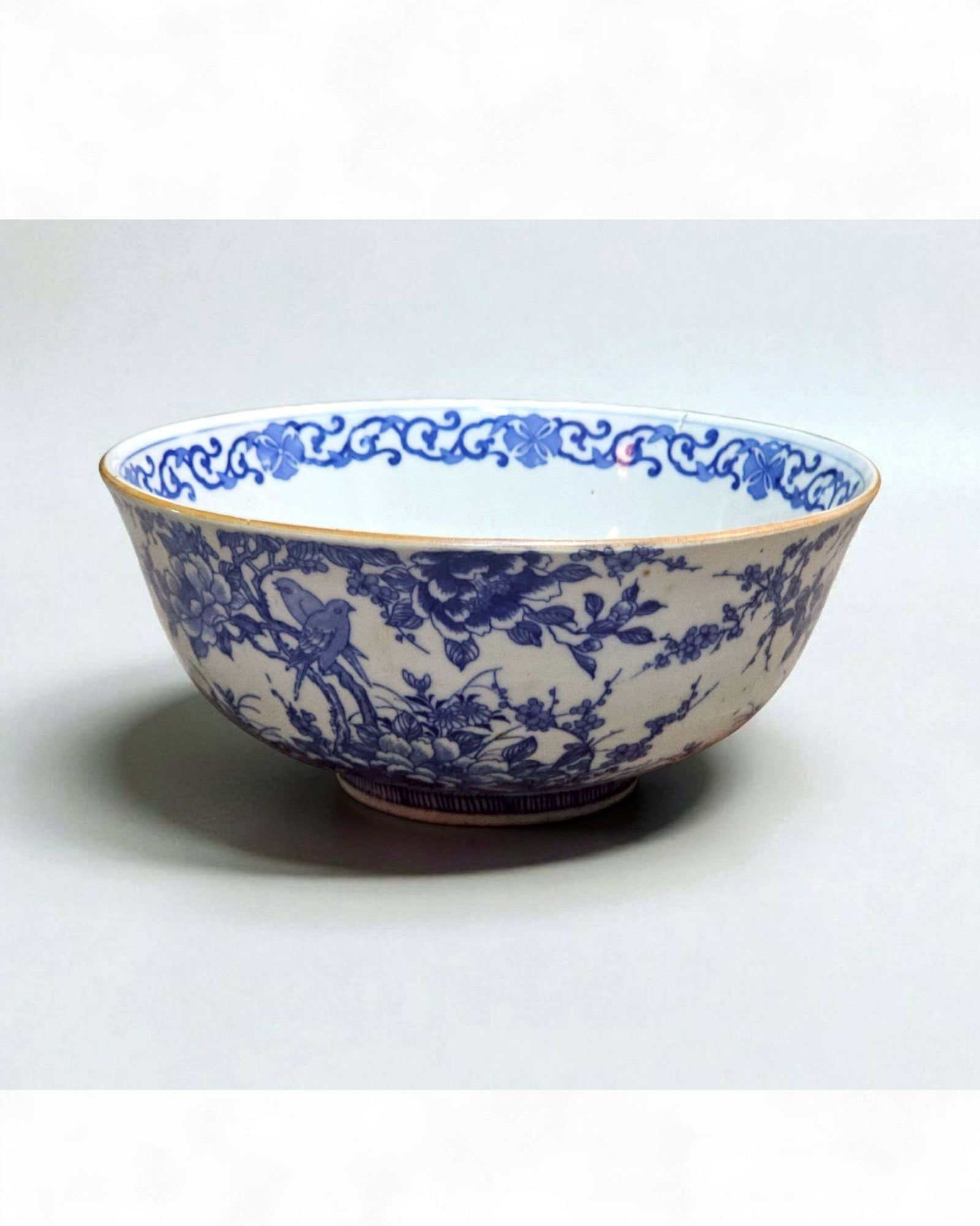 Blue and White Ceramic Bowl with Floral & Bird Motifs
