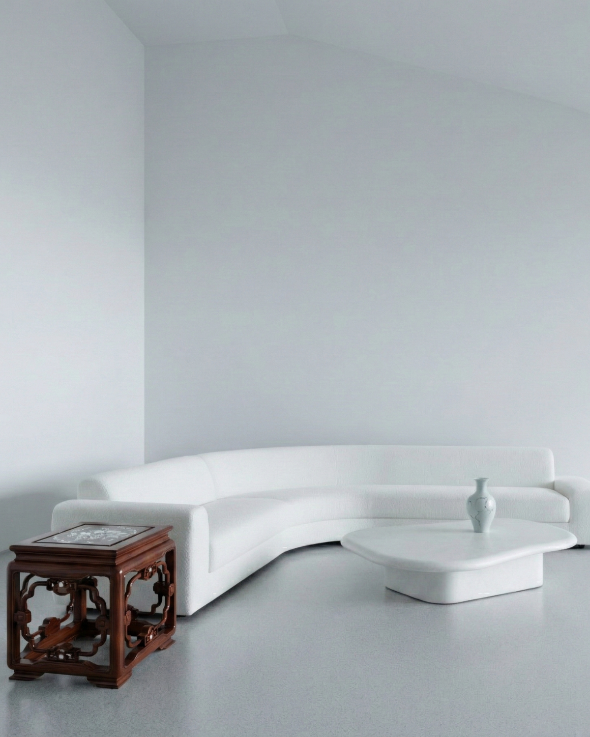Modern white sofa in a minimalistic room with a wooden side table.