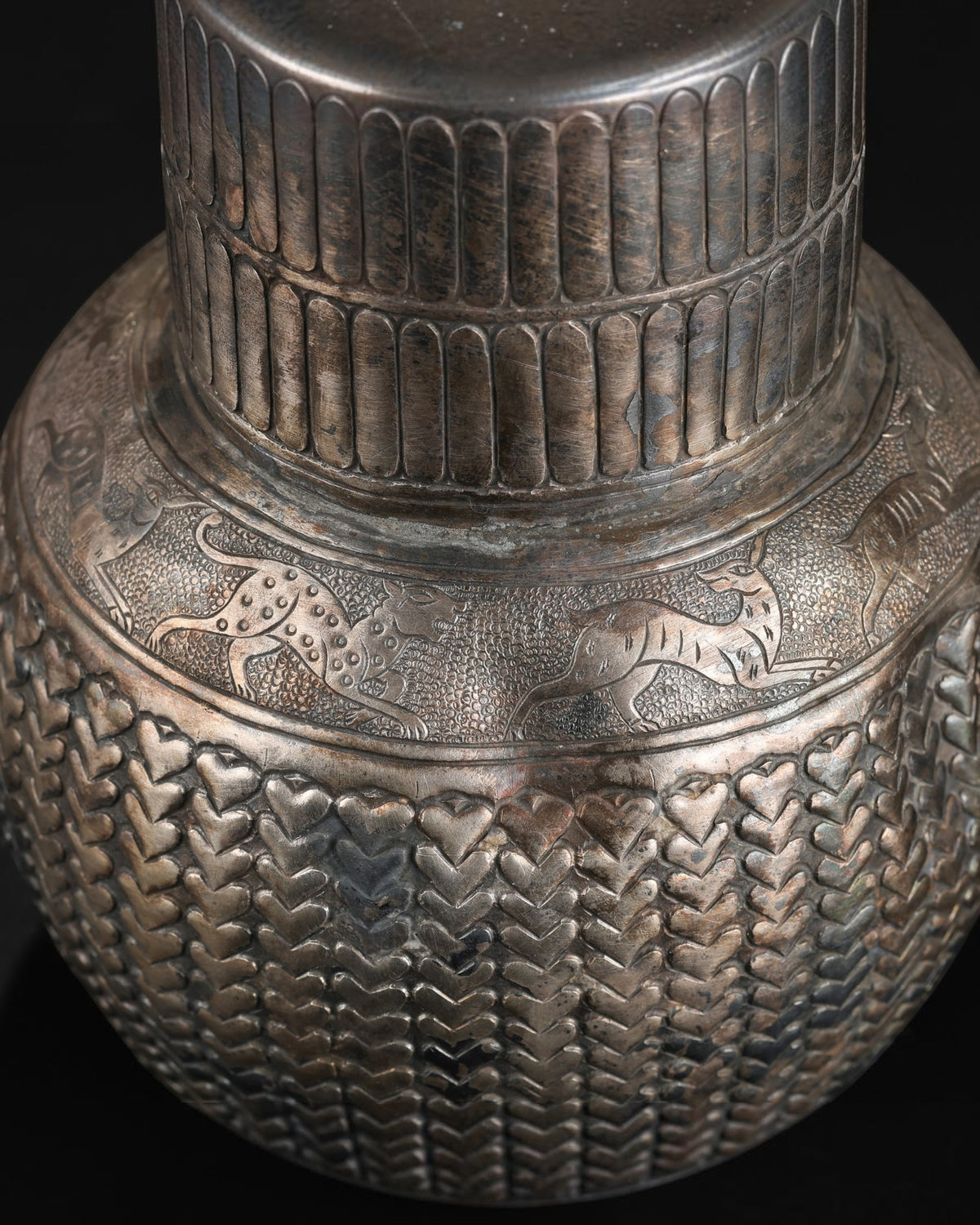 Antique Silver Jug Featuring Intricate Repoussé Decoration and a Heart Patterned Design