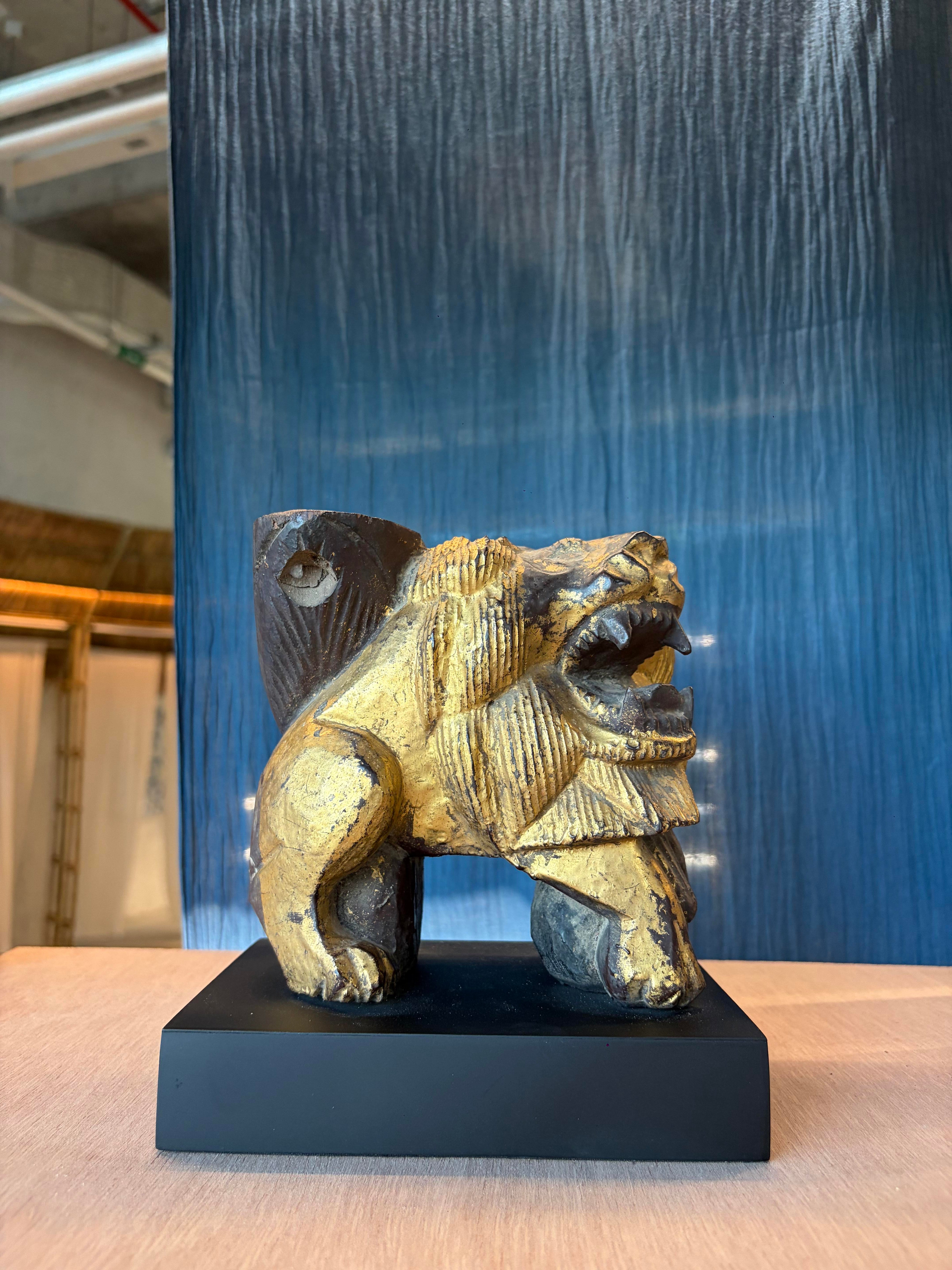 Carved Wooden Lion embellished with Gold Leaf (สิงโตไม้ติดทอง)