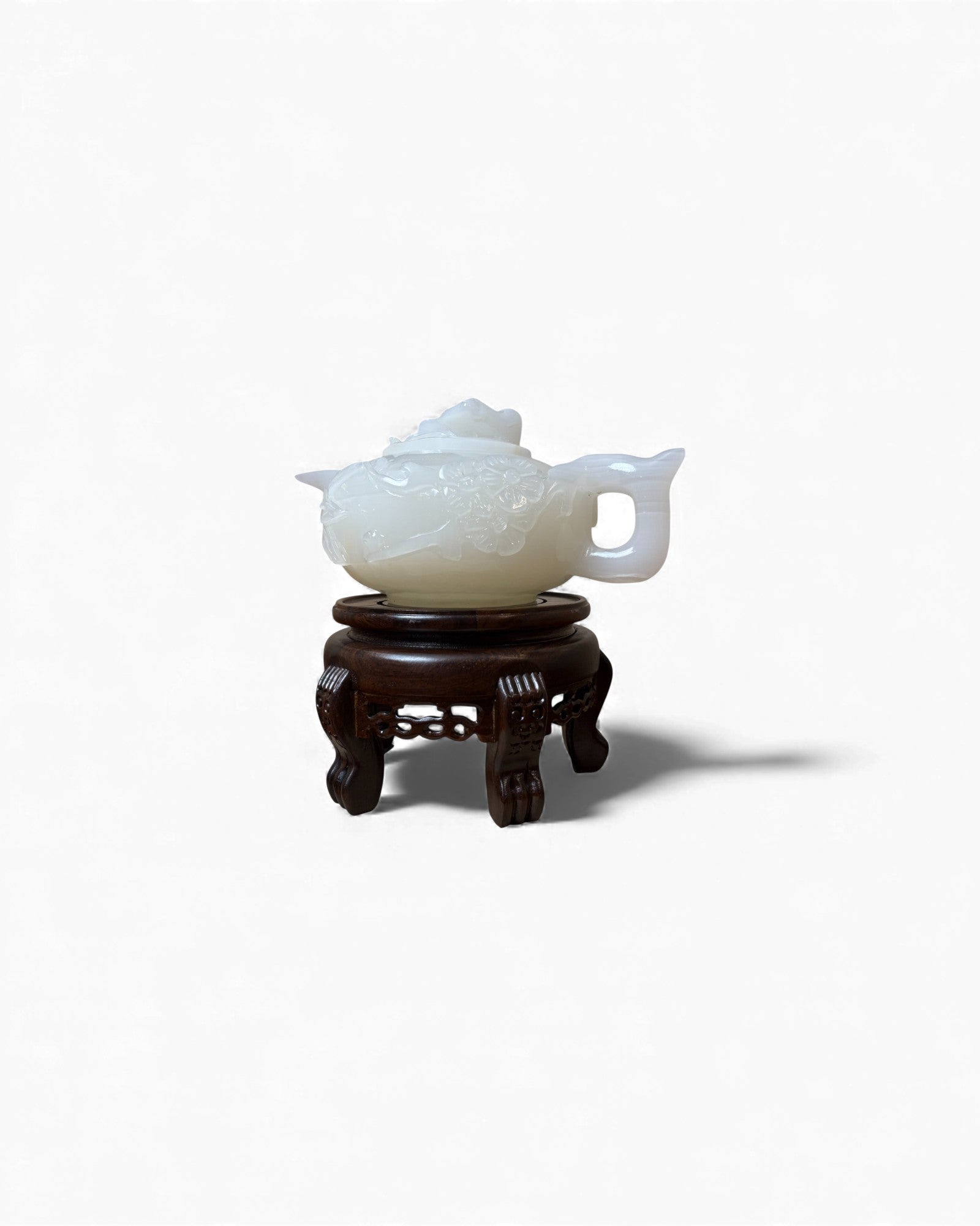 Chinese Carved White Jade Teapot with Floral Relief (with Stand)